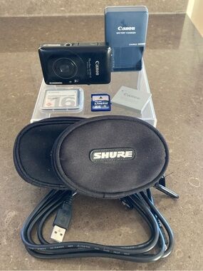 Canon PowerShot SD780 IS Black Digital Camera with accessories shown